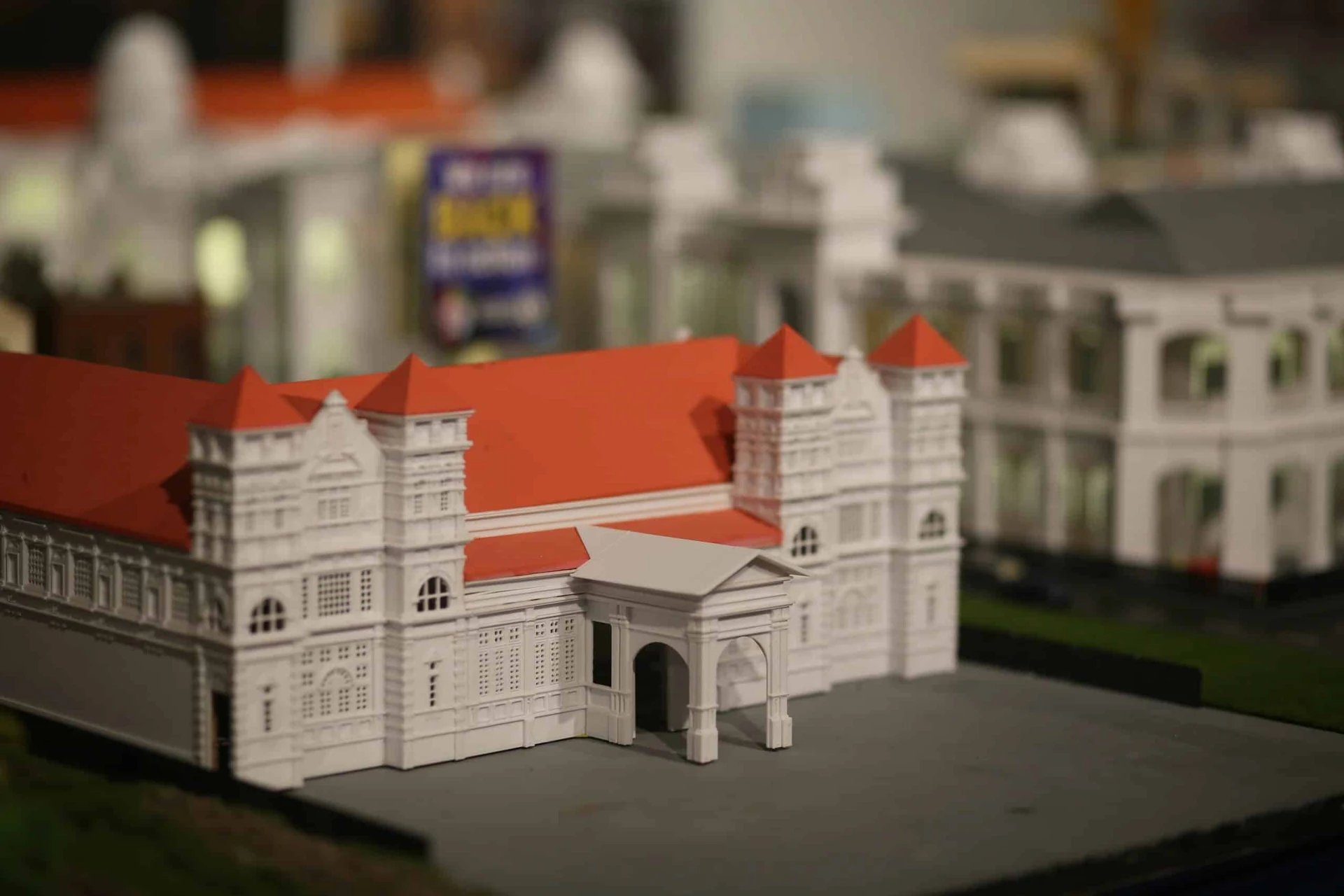 Intricately crafted miniature heritage building with red roofs